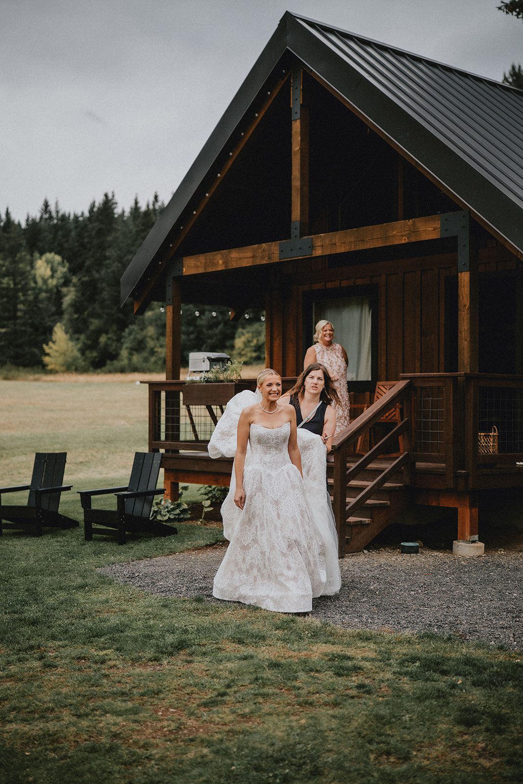 wind-mountain-ranch-rustic-portland-cj-rachel-p007-07 Celebrating in a wedding gown outside the lodge at Wind Mountain Ranch