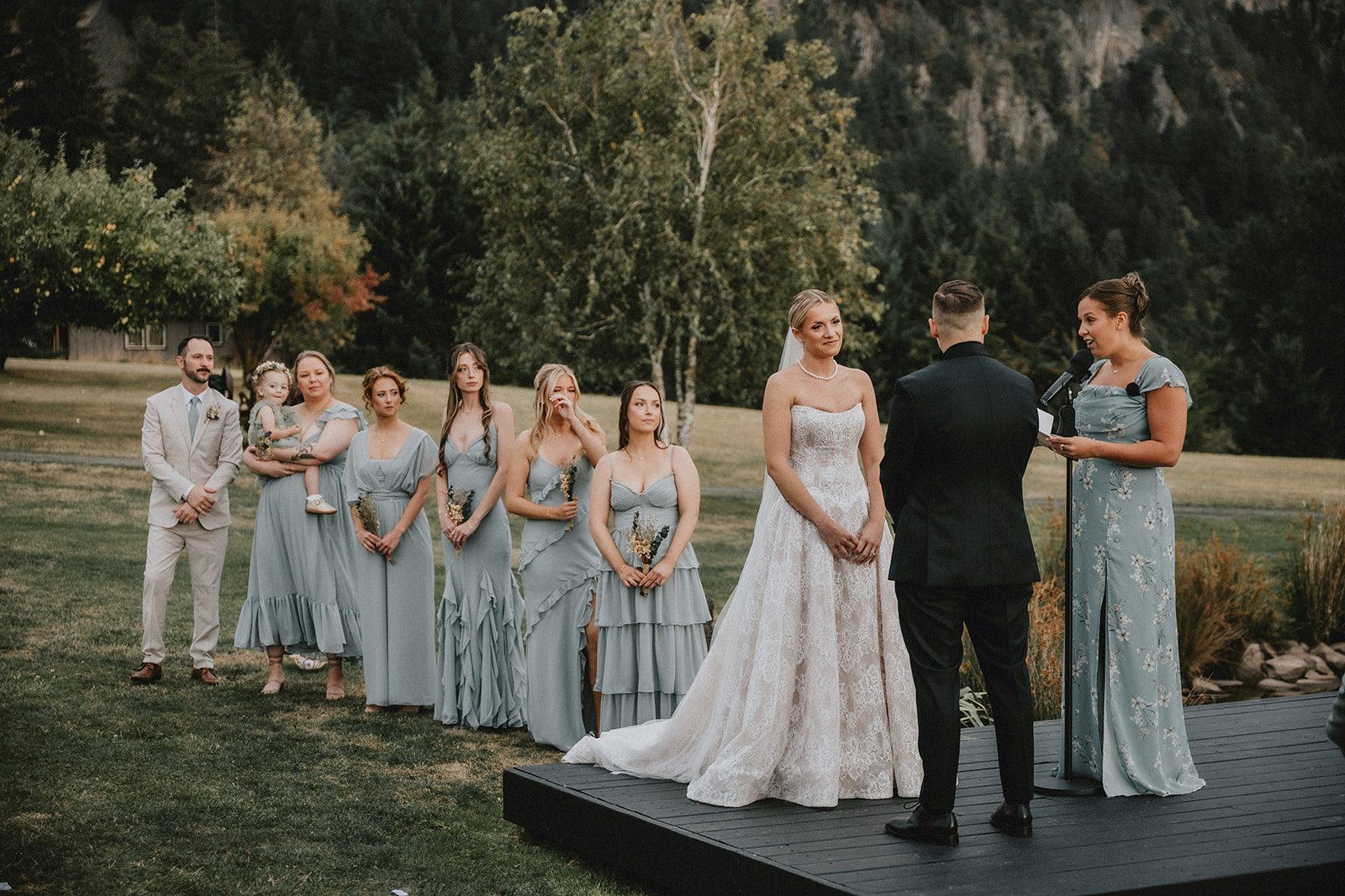 wind-mountain-ranch-rustic-portland-cj-rachel-p013-13 Wedding party standing beside the couple during the ceremony