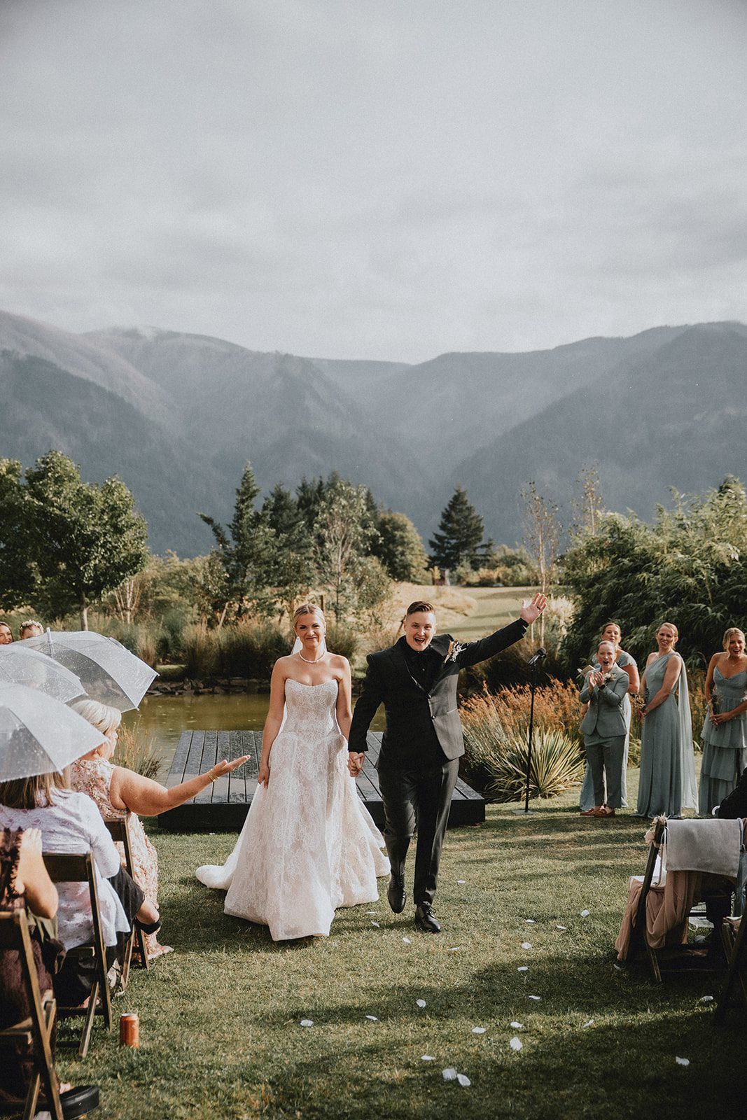 wind-mountain-ranch-rustic-portland-cj-rachel-p016-13 Newlyweds walking back up the aisle at Wind Mountain Ranch