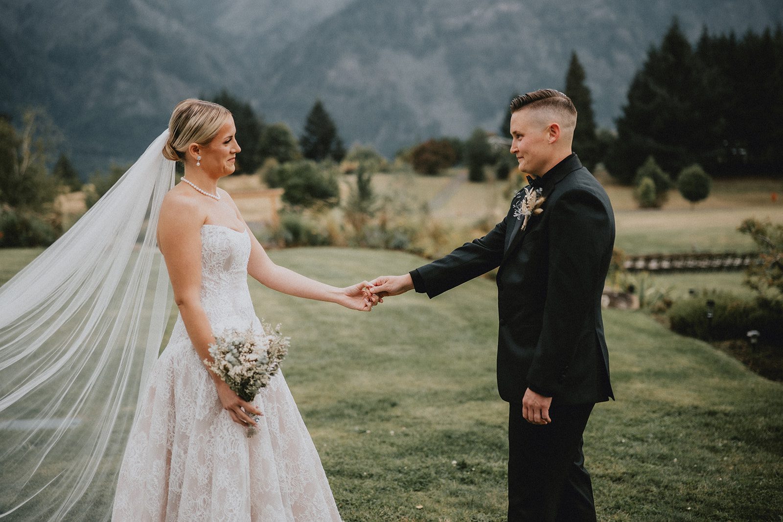 wind-mountain-ranch-rustic-portland-cj-rachel-p020-01 Couple holding hands in the field