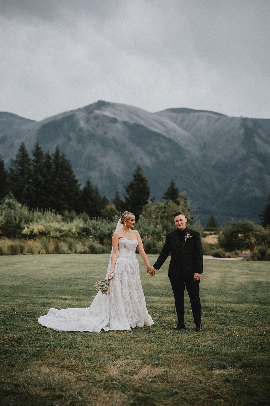 wind-mountain-ranch-rustic-portland-cj-rachel-p021-04 Couple standing together with mountain views at Wind Mountain Ranch