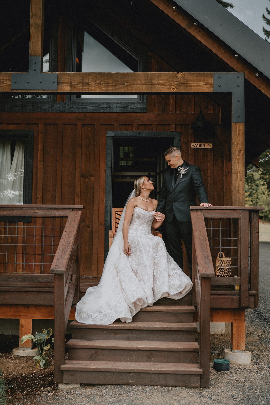 wind-mountain-ranch-rustic-portland-cj-rachel-p027-06 Couple posing on the wooden stairs