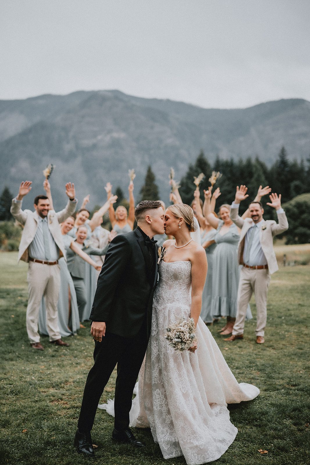 wind-mountain-ranch-rustic-portland-cj-rachel-p031-07 Wedding party cheering for the couple