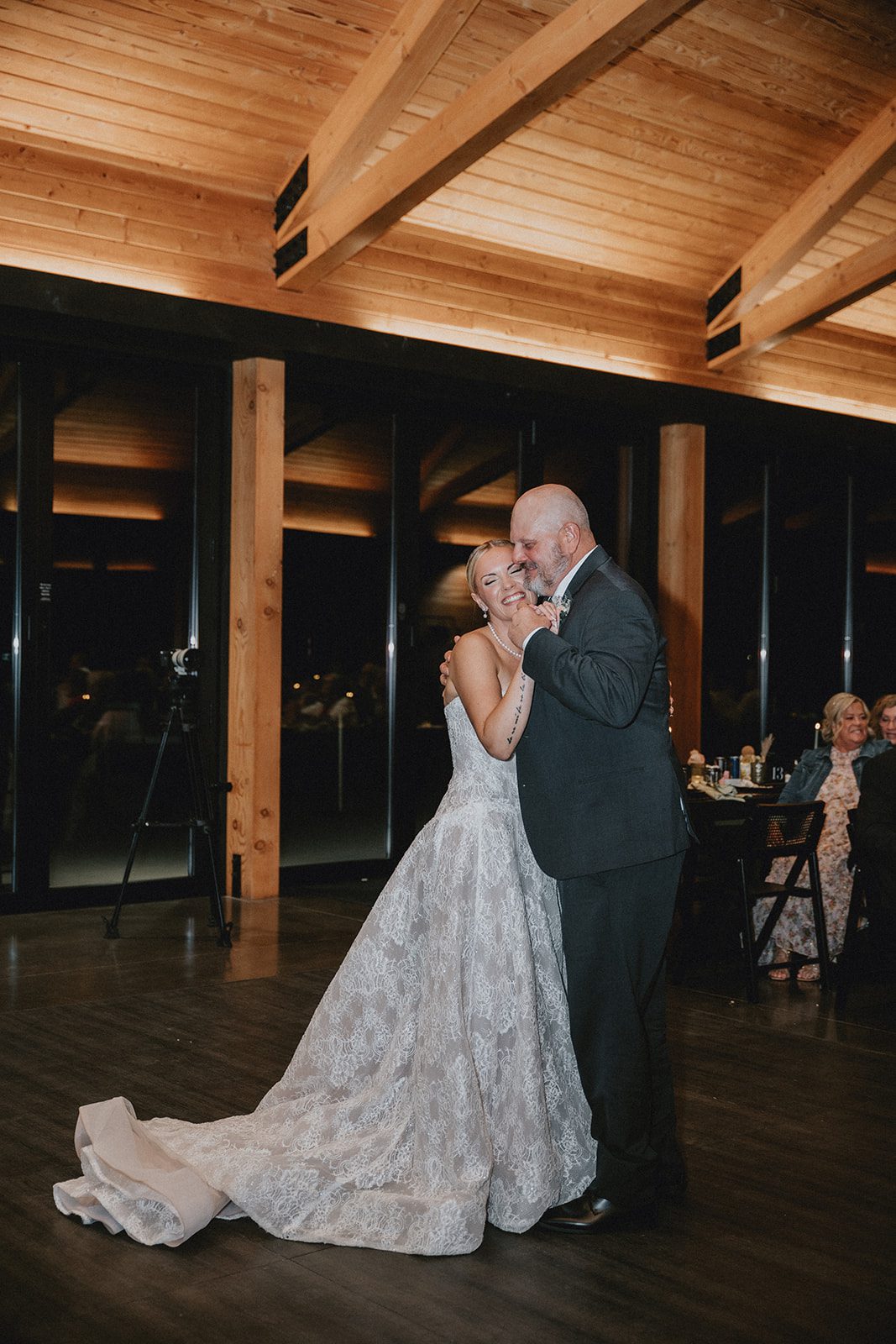 wind-mountain-ranch-rustic-portland-cj-rachel-p035-03 Couple dancing under the wooden beams