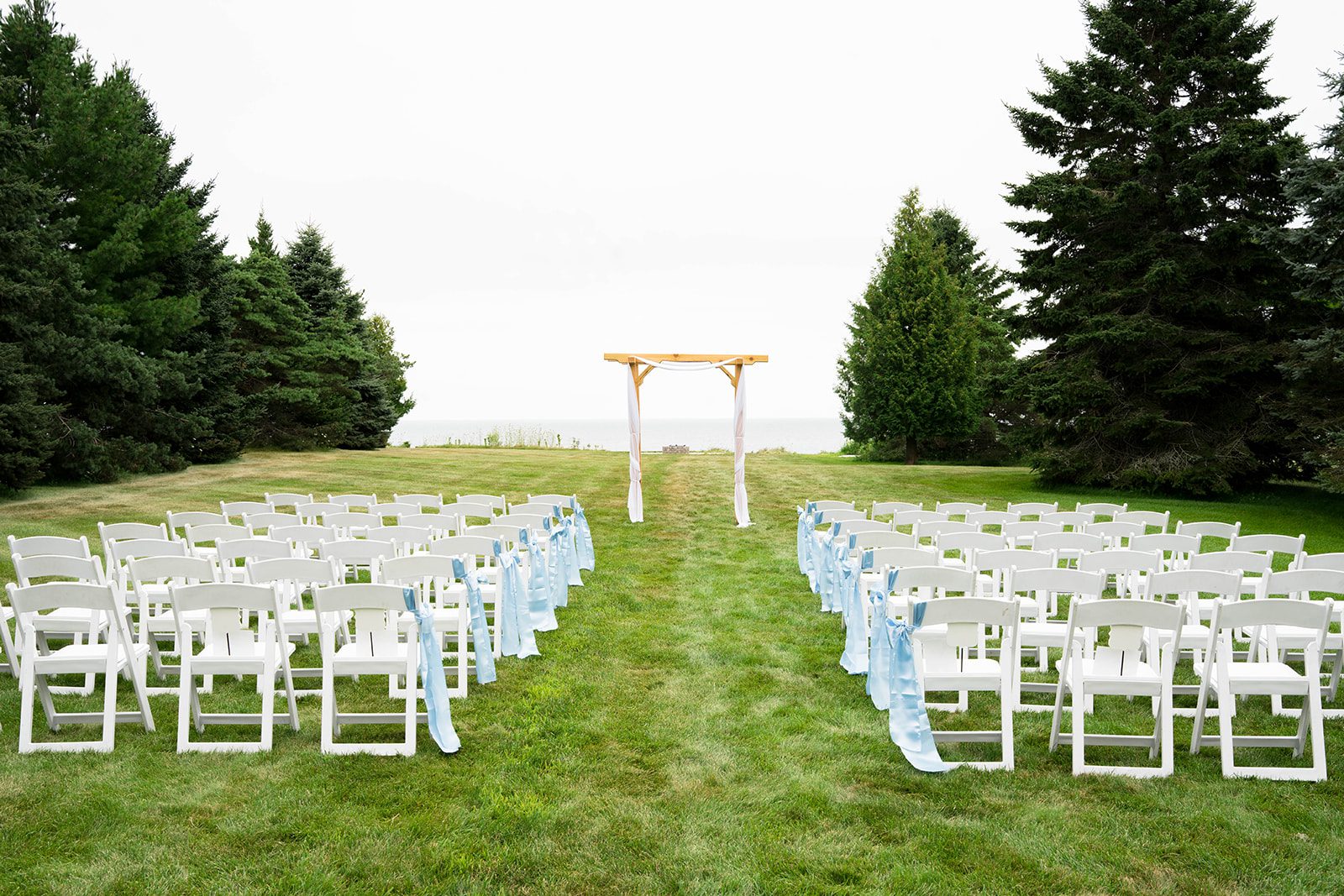 Outdoor ceremony setup on the backyard lawn