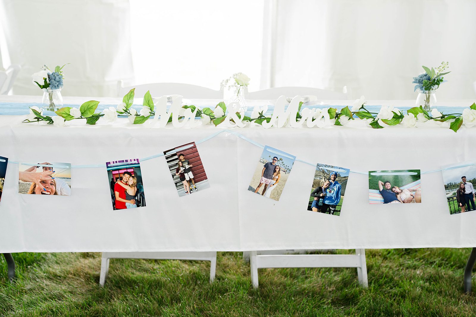 Welcome table decorated with family photos