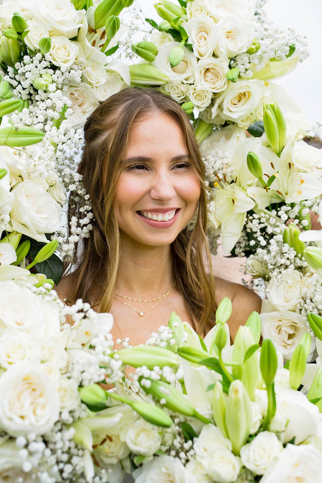 Close portrait of the bride with greenery