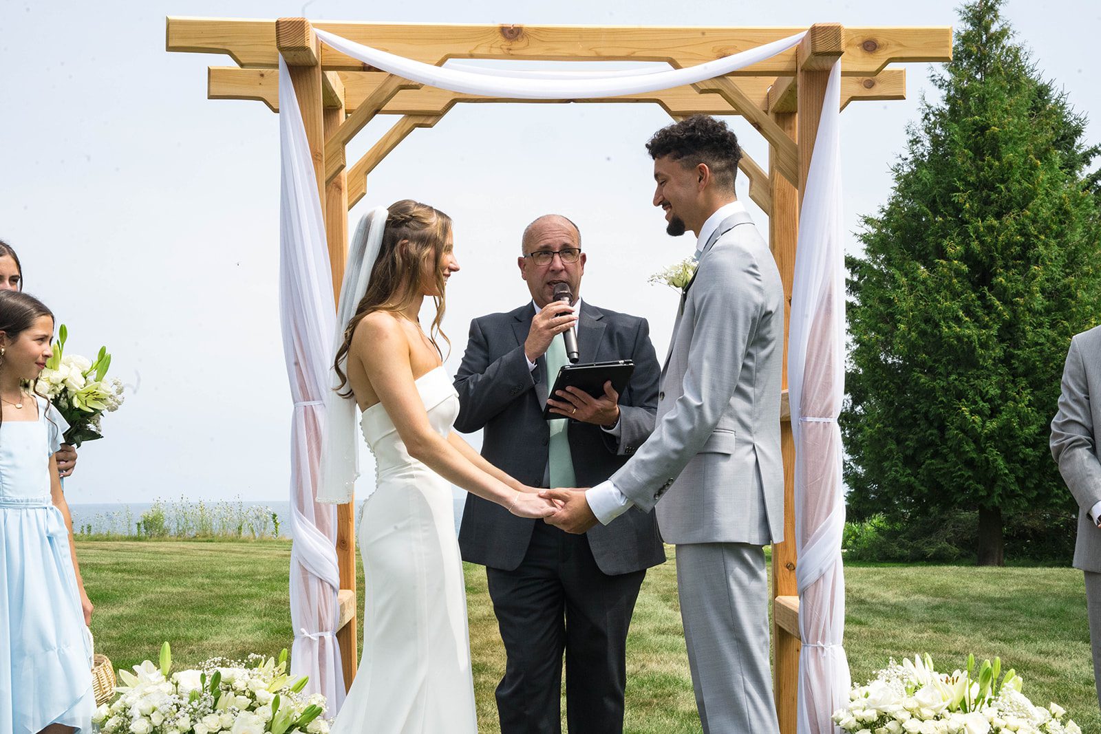 Bride smiling during the vows