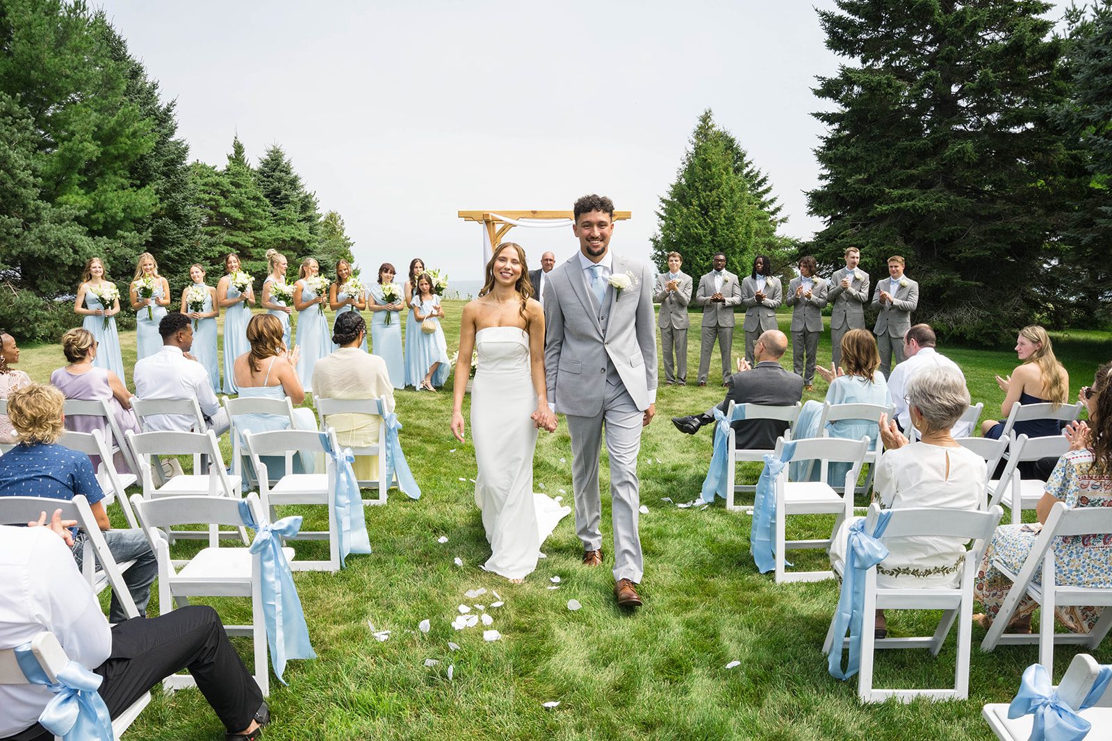 Newlyweds walking back up the aisle