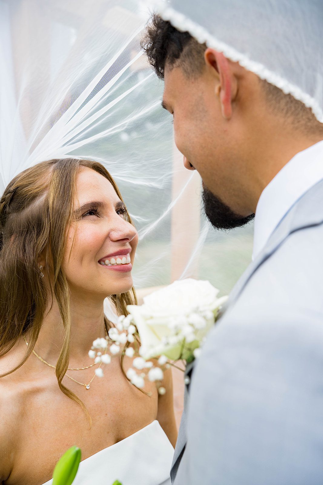 Groom smiling at his bride
