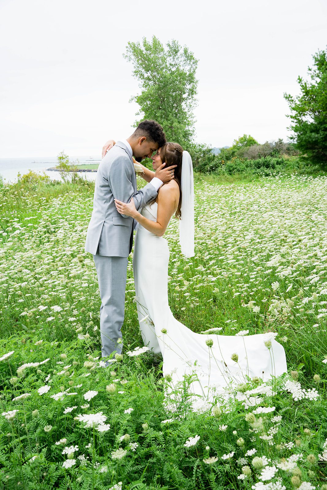 Bride and groom by the trees