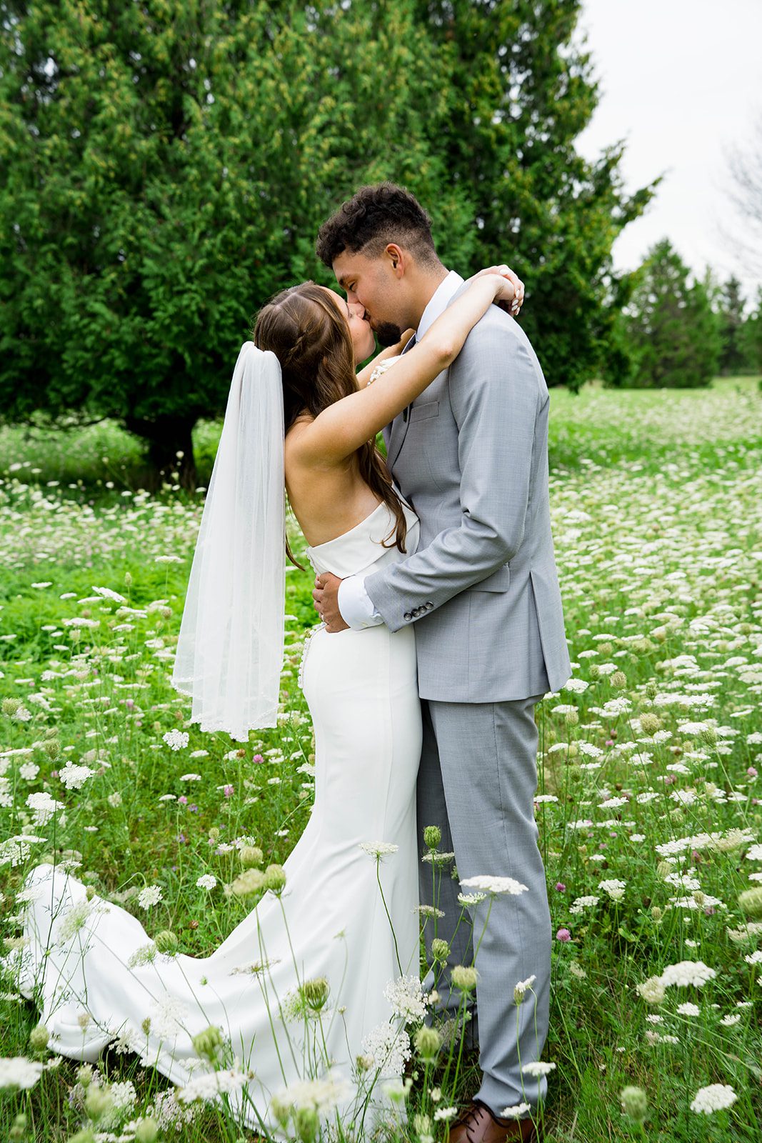 Couple sharing a kiss in the backyard