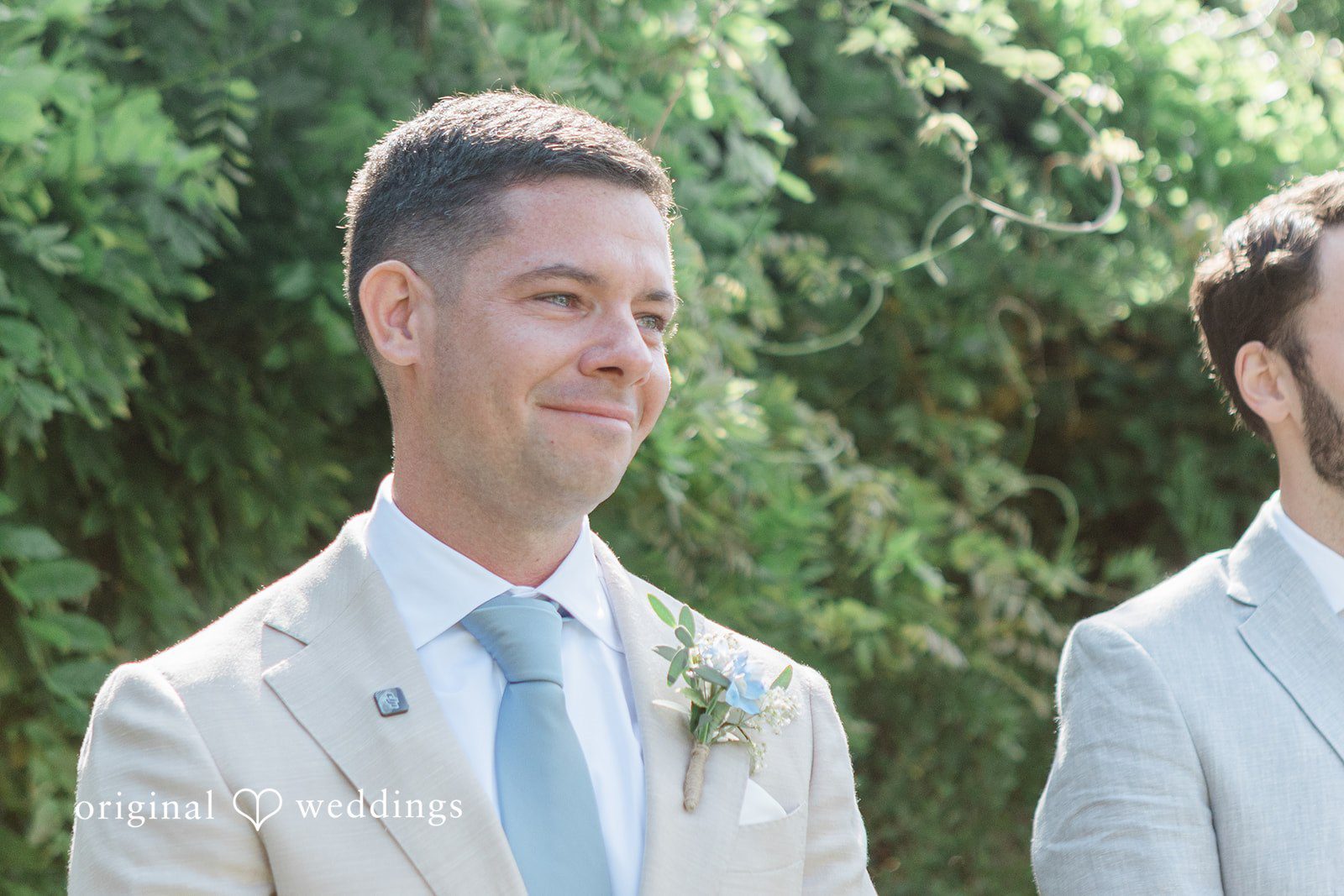 Rachel + Matt Groom smiling as the bride arrives