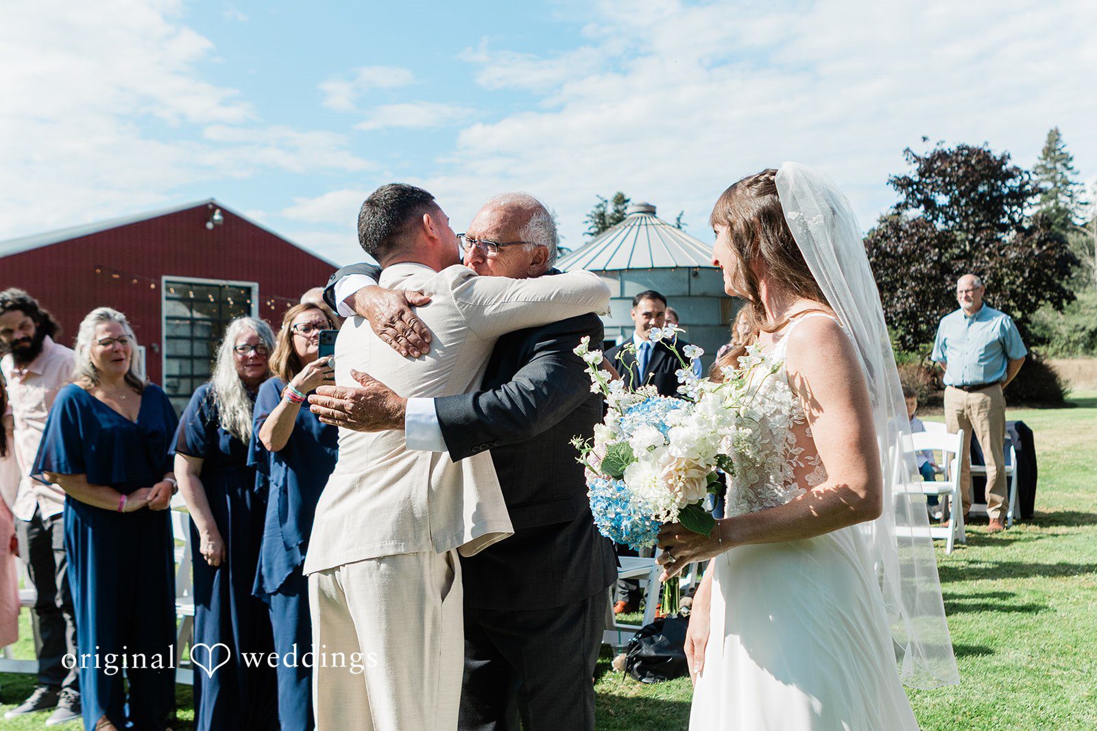 Rachel + Matt Bride and groom hugging guests after the ceremony