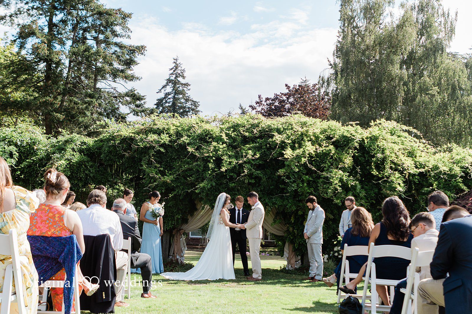 Rachel + Matt Guests watching the ceremony under the trees