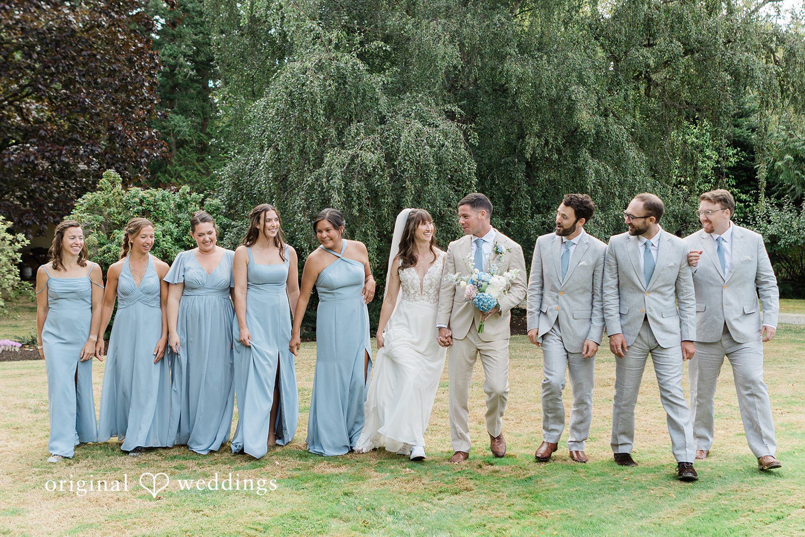 Rachel + Matt Wedding party lined up on the lawn