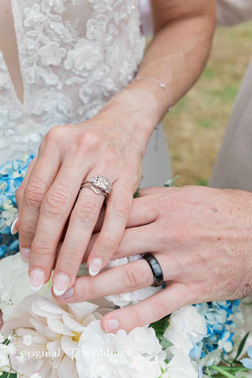 Rachel + Matt Close up of the couple's hands and rings