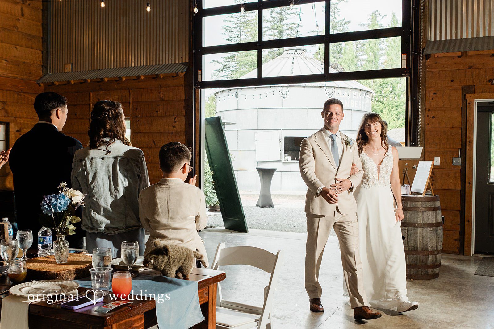Rachel + Matt Couple with family during reception speeches