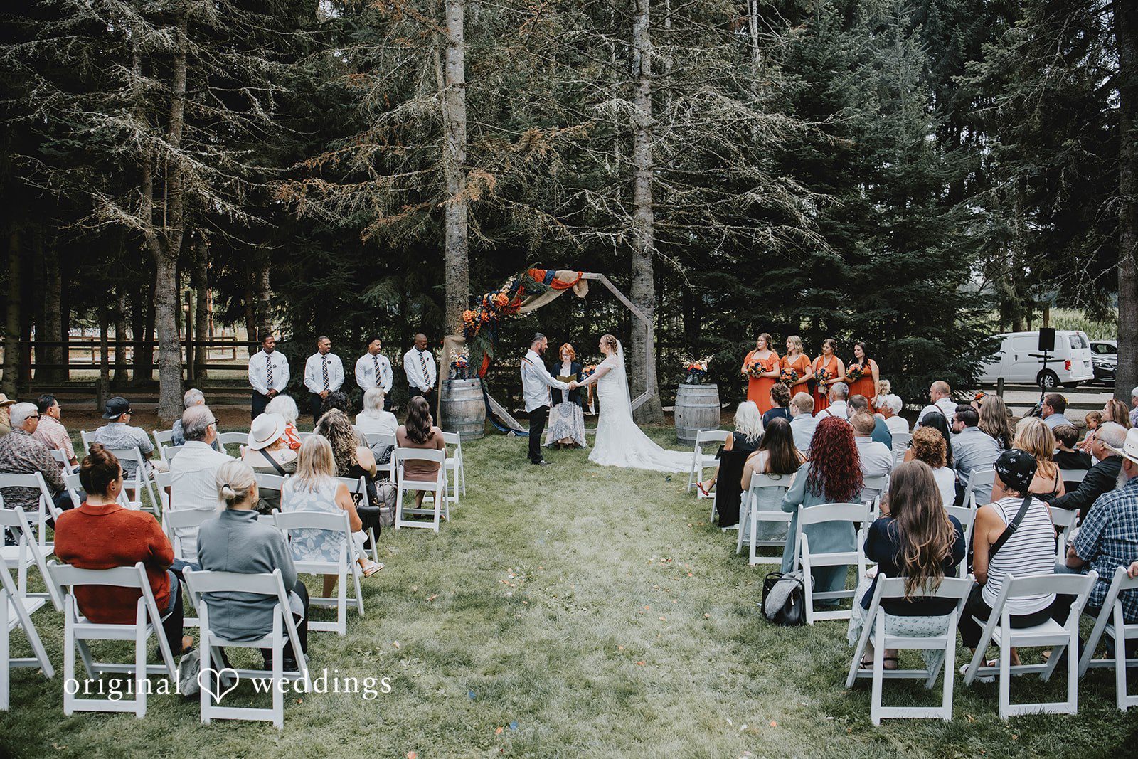 Alex + Simon Wedding ceremony among the trees at Woodland Meadow Farms