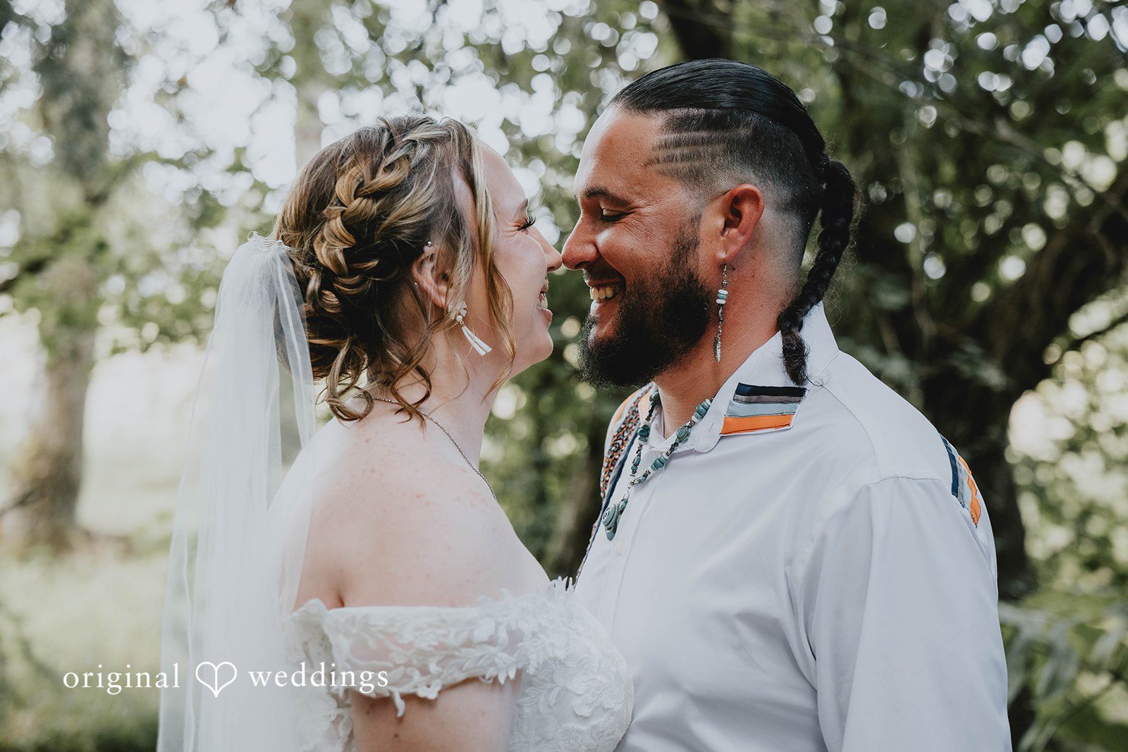 Alex + Simon Alex and Simon smiling together among the trees, captured by Seattle wedding photographers from Original Weddings at Woodland Meadow Farms